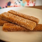 Pumpkin spice cookies dusted in cinnamon and sugar coating