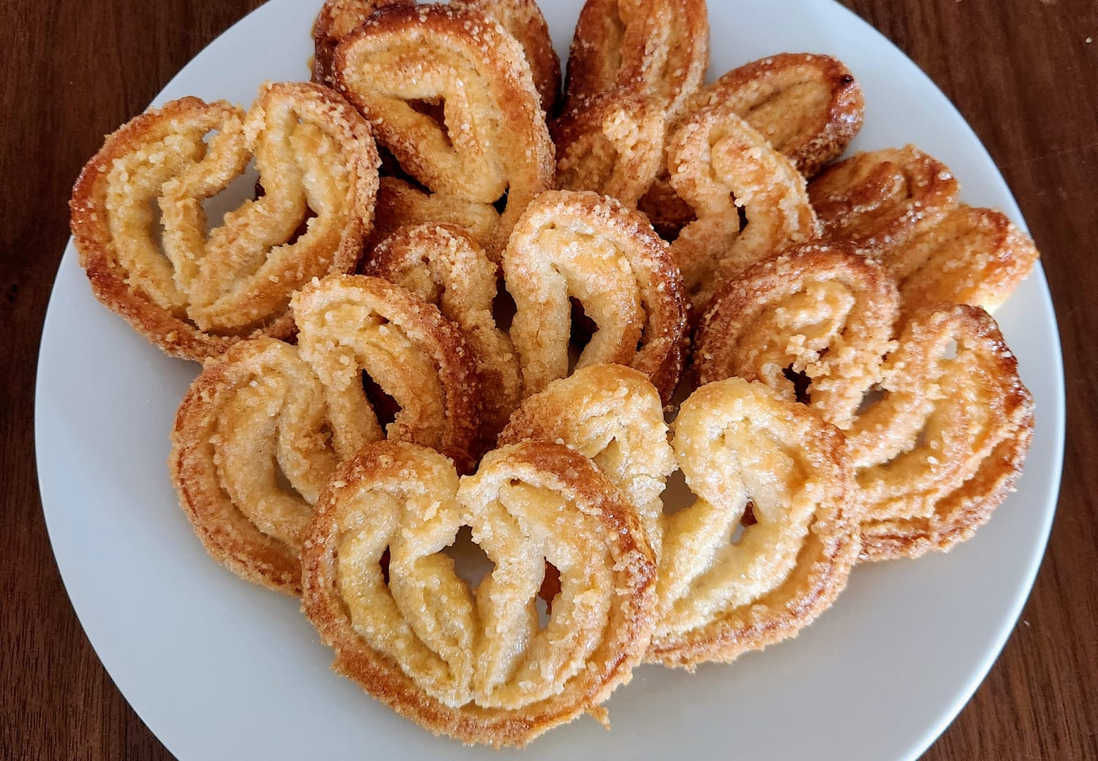 Palmier cookies arranged on a serving tray