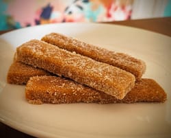 Pumpkin spice cookies dusted in cinnamon and sugar coating