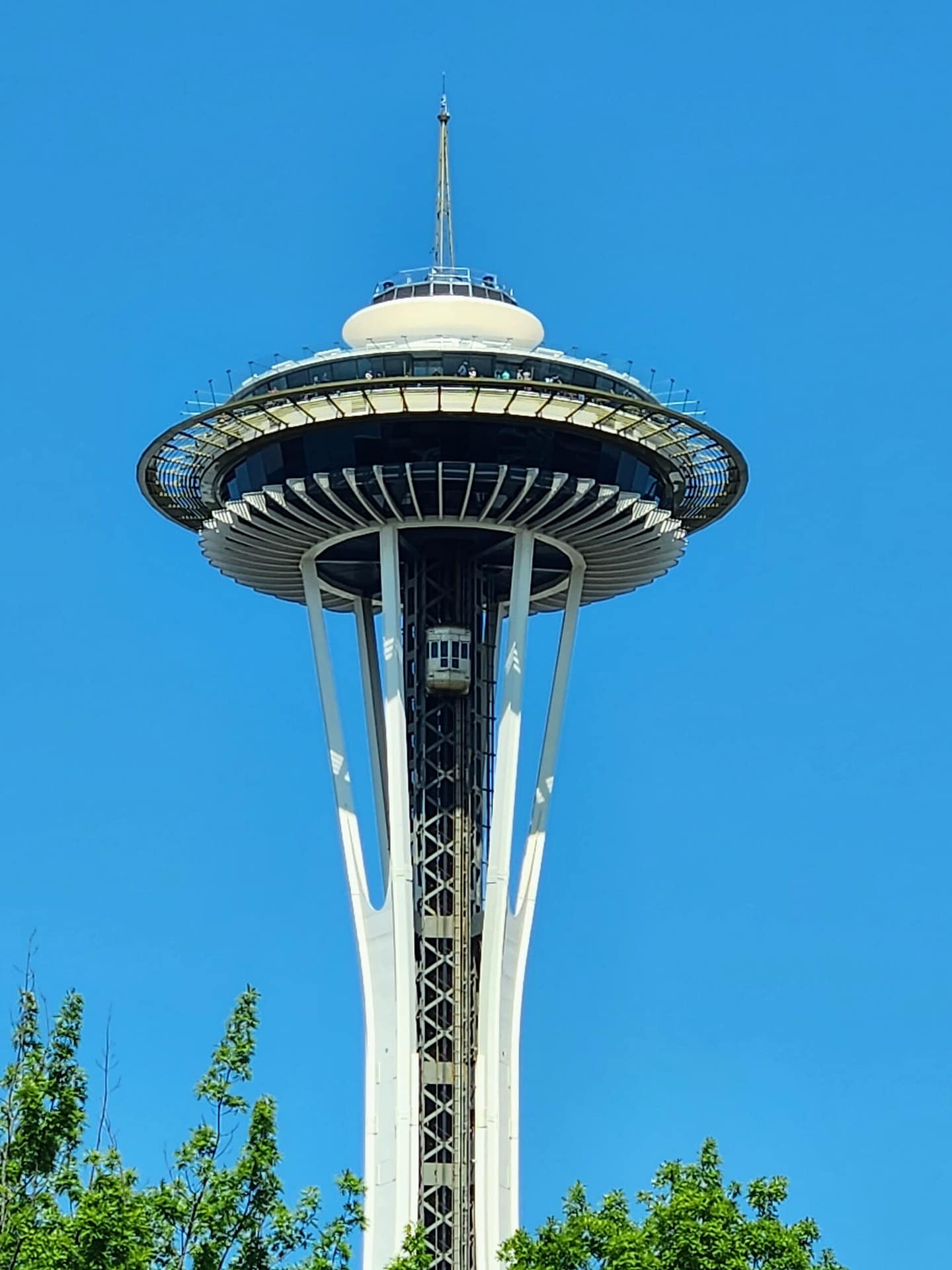 The Space Needle in Seattle on a clear day with a bright blue sky